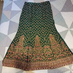 Elegant Green Lengha Skirt With Gold & Red Design